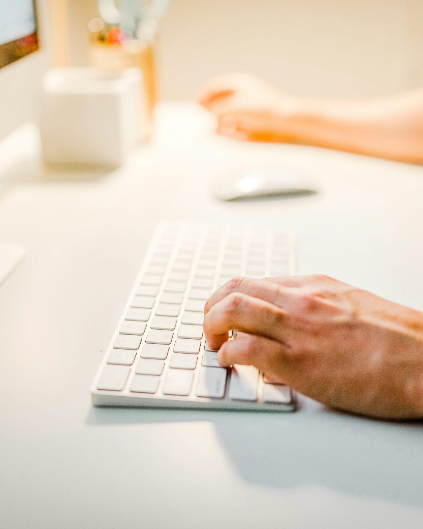 man typing on keyboard. Photo by Austin Distel on Unsplash